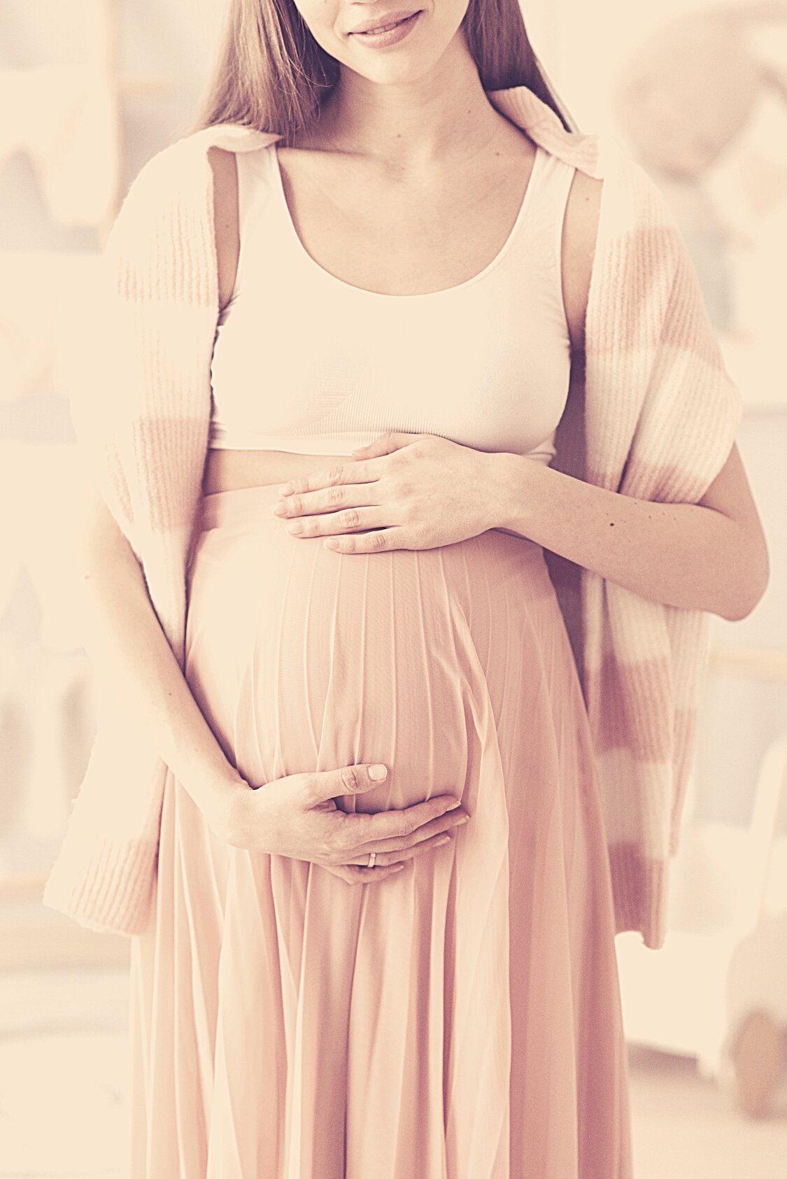 A Pregnant Woman Rubbing Her Baby Bump